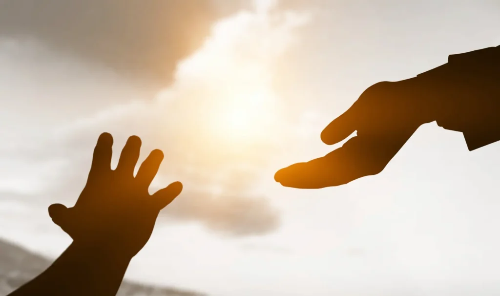 hands reaching out, a representation of the loss of a loved one